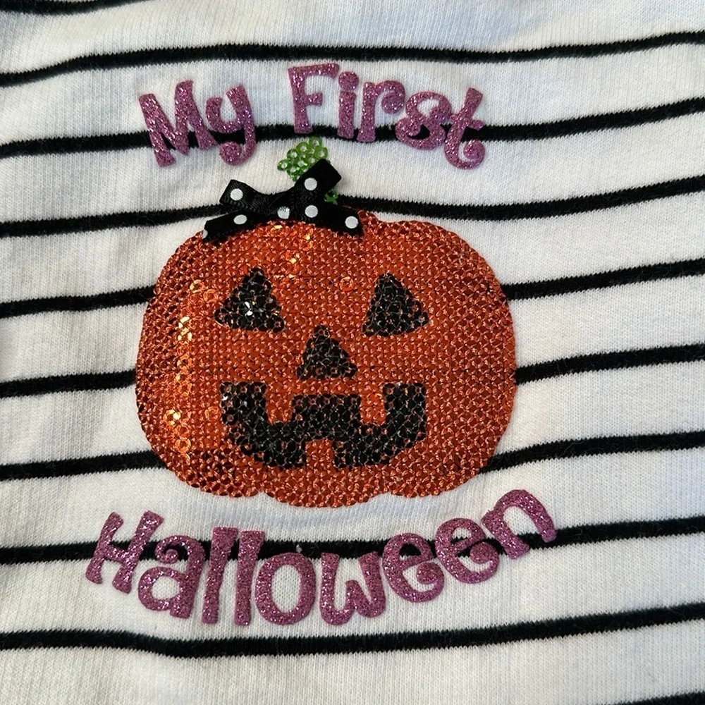 Bundle of my first Halloween clothes. Two long sleeve onesies and a tutu shirt.